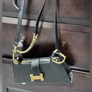 Black woven evening bag with gold hardware